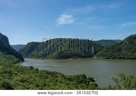 Panarama Of Danube River With Decebalus Head Sculpted In Rock, Danube Gorges (cazanele Dunarii) , Ro