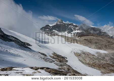 View Of Seewjinengletscher Glacier In Monte Rosa Massif. Schwarzberghorn Mount At Background. Switze