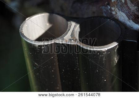 The Muzzle Of The Gun Is Very Close. Firearms In The Details Of Macro.