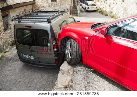 Tende, France - September 4, 2014: Park Job In The Narrow Street Of Medieval Town Of Tende