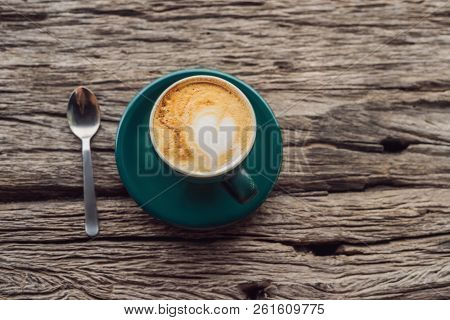 A Cup Of Coffee On The Background Of An Old Wooden Table A Heart For Coffee. St. Valentines Day Conc