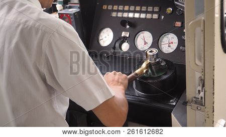 Train Driver Or Crews Is Working On The Train At Control Panel.