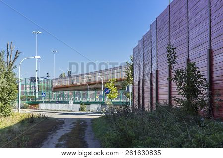 Sound Absorbing Screens At A Crossroad And Overpass. Metal Frames Filled With Glass And Sound-absorb