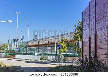 Sound Absorbing Screens At A Crossroad And Overpass. Metal Frames Filled With Glass And Sound-absorb