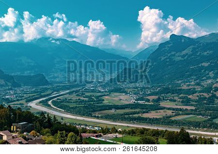 The Border Between Liechtenstein And Switzerland Seen From Triesenberg. The River Rhine Forms The Bo