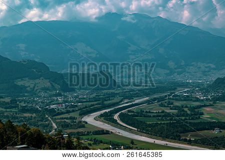 The Border Between Liechtenstein And Switzerland Seen From Triesenberg. The River Rhine Forms The Bo