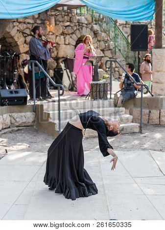 Jerusalem, Israel, September 29, 2018 : Dancer In A Black Authentic Dress Dances To The Music For Vi
