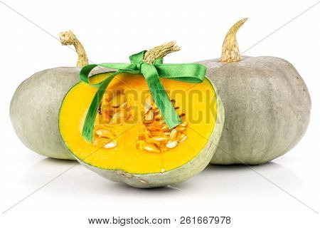 Group Of Two Whole One Half Of Fresh Blue Grey Pumpkin Nagy Dobosi Variety Tied By Green Ribbon Isol