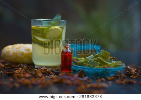 Close Up Of Organic Face Pack Of Cucumber With Aloe Vera Gel And Rose Oil On Wooden Surface In A Gla