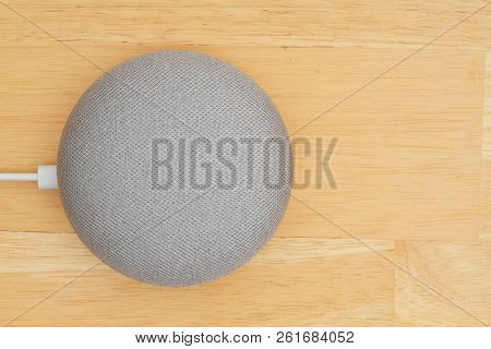 South Carolina, Usa Oct 2018. Illustrative Editorial Image Of  A Google Home Mini Device On A Wood D