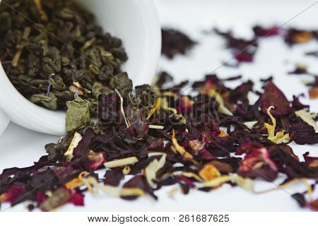 Fruit And Green Tea Petals In Ceramic Cup.