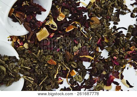 Top View Green And Fruit Tea Petals Isolated On White Background.