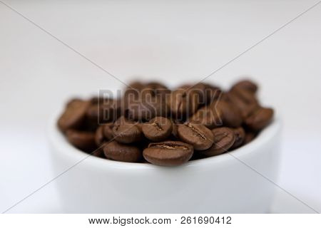 Brown Coffee Drink Seeds In White Cup Background