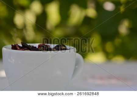 Closeup Cup With Fruit Herbal Tea Isolated