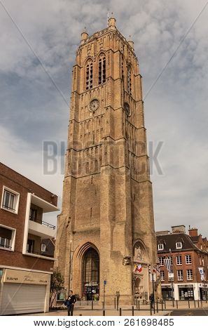 Dunkerque, France - September 16, 2018: The Brown Brick Belfry Of Dunkirk Towers Over Houses Under C