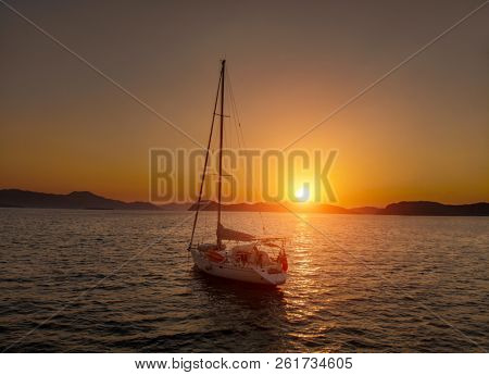 Bare boat during sunrise in Aegean Sea close to Datca Turkey
