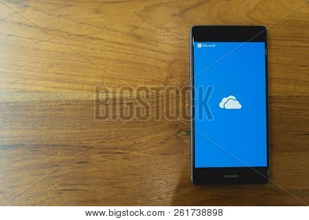 Chiang Mai, Thailand - Mar 28,2018: Huawei Mobile Phone With Onedrive On Screen On Wooden Table. Mic