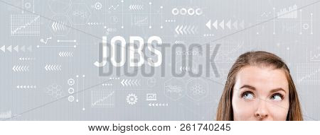 Jobs With Young Woman Looking Upwards On A Gray Background
