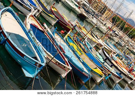 Nice, France - 2018.
Small Fishing Boats Docked In The Small Harbor Of Nice, French Riviera.