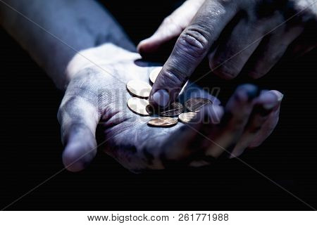 Hand Of Beggar With Some Coins Begging For Money (poverty, Hunger, Anxiety, Bankrupt Concept)