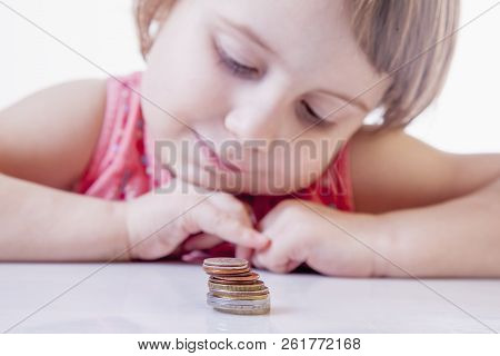 Best Motivation Is Money. Happy Business Child With Coints. Selective Focus On Coins.