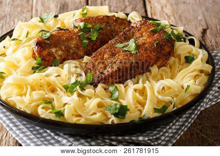 Delicious Recipe For Rich And Creamy Chicken Lazone Pasta From New Orleans Close-up On A Plate. Hori
