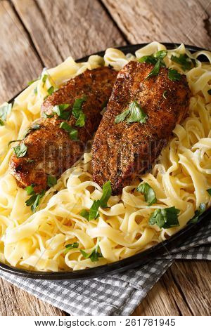 American Food: Chicken Lazone Breast Fried With Spices And Fettuccine Pasta In A Creamy Sauce Closeu