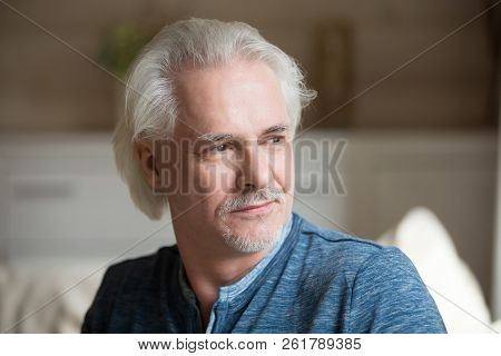 Thoughtful Senior Mature Man Looking Away Dreaming Of Happy Futu