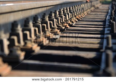 Railway Coupling Bolts Leaving Into The Distance. Perspective.