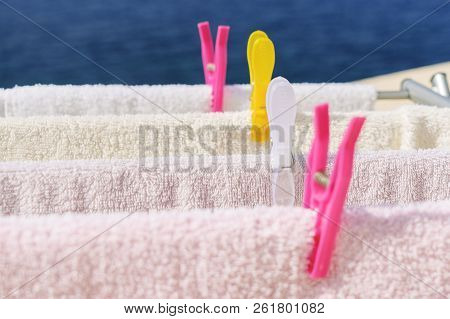 Fresh Clean Towels Drying On Washing Line Outdoor. Laundry Hangs On The Dryer. Drying Clean Clothes 
