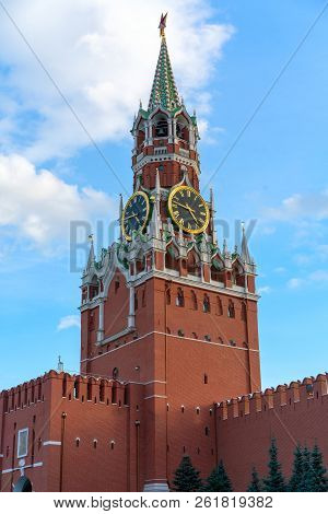 The Famous Spasskaya Tower Of Moscow Kremlin, Russia. Spasskaya Tower On The Blue Sky Background. An