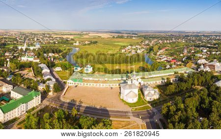 Beautiful Panoramic View Of Suzdal In Summer At Sunrise. Resurrection Church On The Market Square In