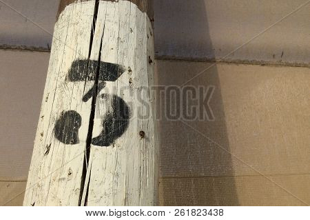 Number Three, Black Figure Three On A White Background, Number On A Pole, Dense Mesh As A Background