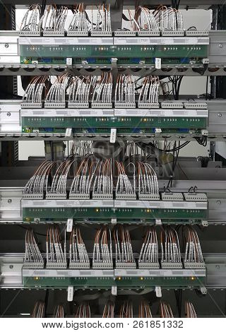 Electrical Parts And Mechanical Parts On Big Gear And Drum Rolls On White Floor