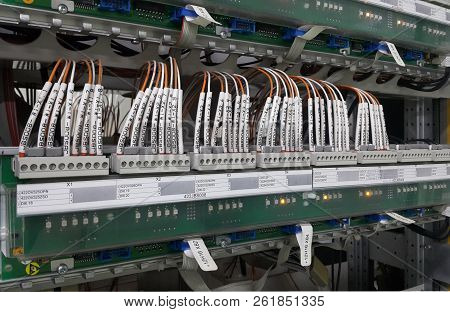 Electrical Parts And Mechanical Parts On Big Gear And Drum Rolls On White Floor