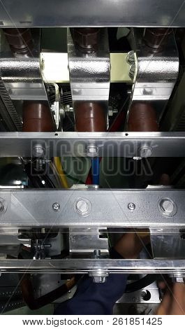 Electrical Parts And Mechanical Parts On Big Gear And Drum Rolls On White Floor