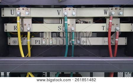 Electrical Parts And Mechanical Parts On Big Gear And Drum Rolls On White Floor