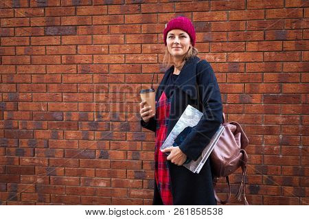 Portrait Female Student On Bright Brick Background. Beautiful Modern Urban Young Woman Wearing Red K