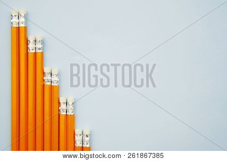 Mock Up Ready For Adding Text. Business Or Educational Concept. Yellow Pencils On Blue Background. I