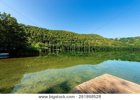Lago Di Levico (lake) With Mountain And Forest, Levico Terme, Italy, Europe