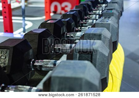 Black Rubber Dumbbells. Hexagonal Heavy Duty Weight Set Used For Serious Hardcore Gym Workouts, Cros