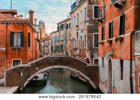 Traitional Venice Canal With Bridge And Old Houses, Italy