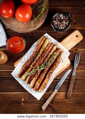 Pork Chipolata. Close-up View Of Fried Sausages. Meat Dish