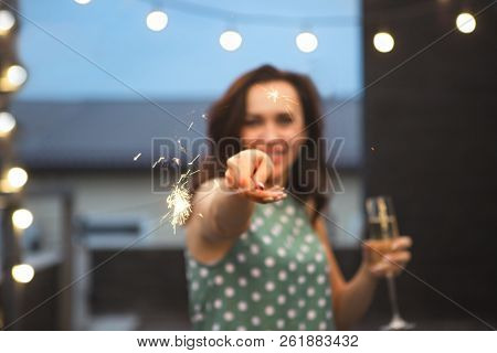 Portrait Of The Woman With Flute Of The Sparkling Wine And Bengal Fire Having Fun On The Party. Focu