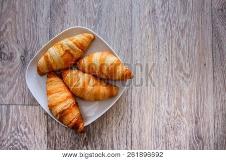 A Rich Variety Of Food Photography Croissant.
Delicious Croissants On A Square White Plate On A Wood