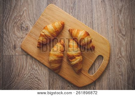 A Rich Variety Of Food Photography Croissant.
Delicious Croissants On A Square White Plate On A Wood