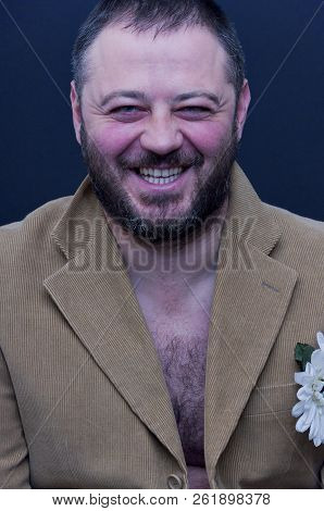 Portrait Of Laughing Man With Velvet Jacket On A Naked Body