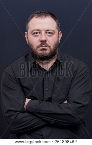 Portrait Of Serious Man With Black Shirt
