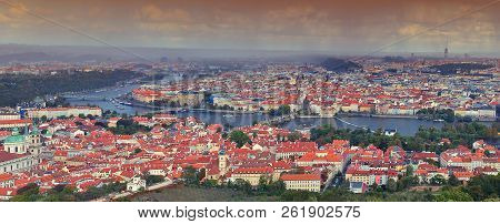 Panorama Of Prague With Vltava River And Prague Bridges Under A Rain Storm.