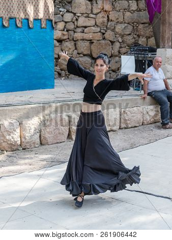 Jerusalem, Israel, September 29, 2018 : Dancer In A Black Authentic Dress Dances To The Music For Vi